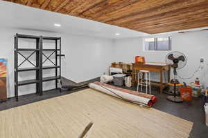 Workout room featuring wooden ceiling and recessed lighting