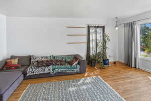 Living area featuring wood finished floors and baseboards