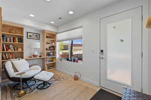 Living area with baseboards and recessed lighting