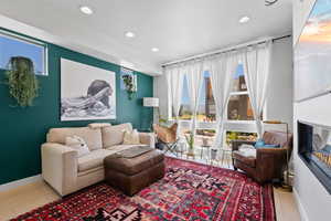 Living room with wood finished floors and recessed lighting