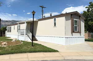 Clean and move-in ready! This well-maintained manufactured home features fresh skirting, a charming covered porch, and ample off-street parking. Enjoy mountain views and a quiet setting near the end of the street.