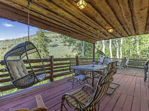 Wooden terrace featuring outdoor dining space