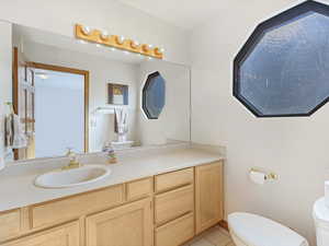 Bathroom with vanity and tile patterned floors