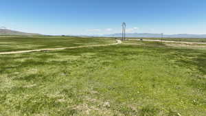 View of home's community with a rural view and a mountain view