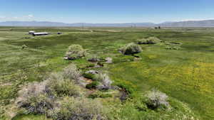 Aerial overview of property's location featuring rural landscape and mountains