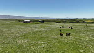 View of mountain backdrop featuring rural landscape and agricultural land