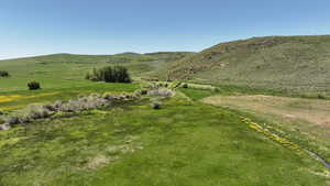 View of mountain backdrop featuring rural landscape