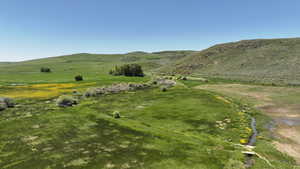 View of mountain backdrop with rural landscape
