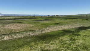 View of yard featuring a view of rural / pastoral area and a mountain view