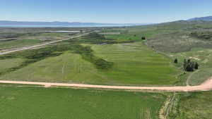 Aerial overview of property's location with rural landscape and mountains