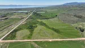 Aerial view of property's location with rural landscape and a water and mountain view