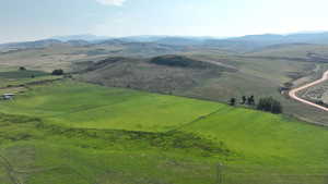 View of mountain backdrop with rural landscape