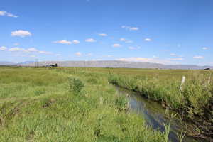 View of mountain backdrop featuring rural landscape