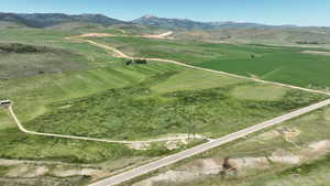 View of mountain backdrop featuring rural landscape