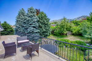 View of patio featuring a mountain view and an outdoor living space