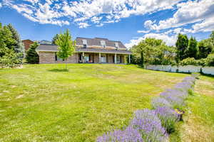 View of yard featuring a porch