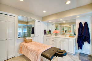 Full bathroom with vanity, recessed lighting, a shower stall, and tile patterned flooring