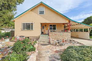 Front of Home with 2 Car Carpot & Xeriscaped Yard
