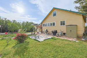 Back of Home with Patio & Grass Area