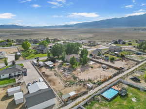 Aerial perspective of suburban area featuring a mountainous background