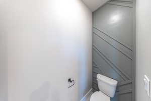 Bathroom with toilet and baseboards