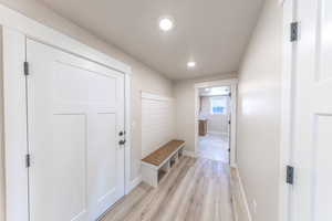 Mudroom featuring recessed lighting and light wood-style floors