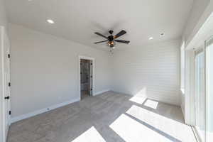 Unfurnished bedroom featuring light colored carpet, recessed lighting, and a ceiling fan
