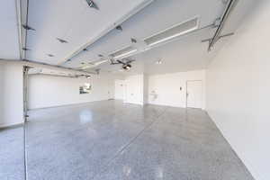Garage featuring painted walls and epoxy floors.