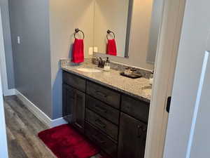 2 doors to the common bath, one for entry and another separating the vanity from the tub/toilet