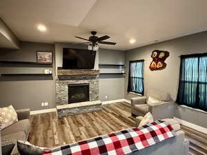 Main floor family room with floating shelves and gas stove.