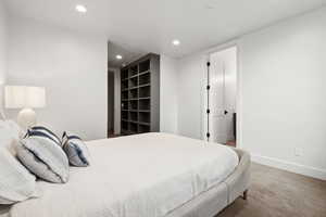Carpeted bedroom featuring recessed lighting and baseboards