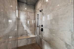 Bathroom with a tile shower