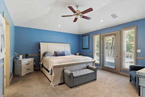 Bedroom featuring light colored carpet, access to exterior, lofted ceiling, a ceiling fan, and recessed lighting