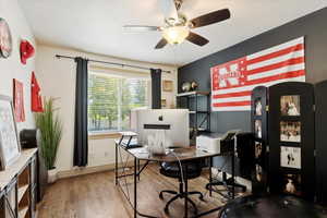 Office space featuring wood finished floors and ceiling fan