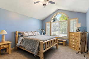 Bedroom featuring lofted ceiling, carpet, and ceiling fan