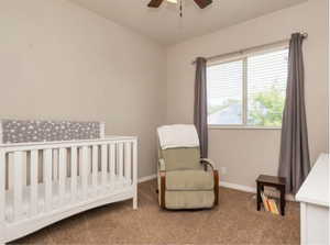 Bedroom featuring carpet and ceiling fan