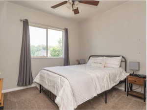 Bedroom featuring carpet flooring and a ceiling fan