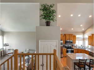 Kitchen featuring appliances with stainless steel finishes, recessed lighting, and a center island