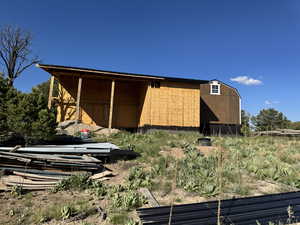 View of back of addition- can be used as carport or covered deck