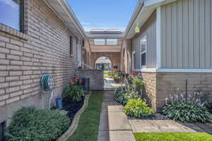 Walkway patio area leading to front door, trophy room, or back yard