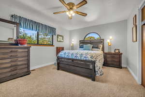 Master Bedroom 1. Carpeted bedroom featuring baseboards and a ceiling fan
