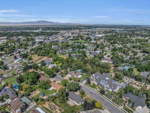 Aerial overview of property's location featuring mountains and nearby suburban area