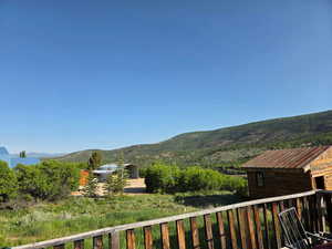 Back deck day view of closest neighboring home o the west.