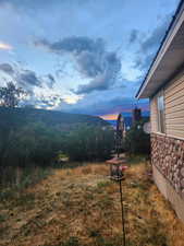 Back deck sunrise view of closest neighboring home o the East
