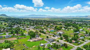 Aerial perspective of suburban area with a mountainous background