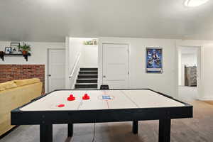 Playroom with carpet floors and baseboards