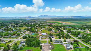 Aerial perspective of suburban area with a mountain backdrop