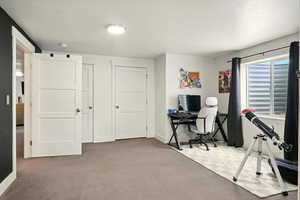 Office area featuring carpet flooring and baseboards