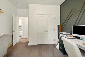 Carpeted office space featuring baseboards