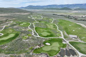Bird's eye view of mountains and a golf course